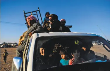  ?? Bulent Kilic / AFP / Getty Images ?? Displaced civilians arrive on the outskirts of Raqqa as U.S.-backed forces prepare to recapture the city.