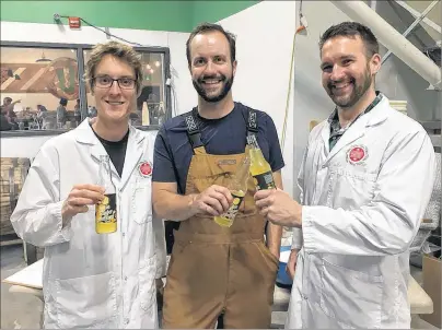  ?? SUBMITTED PHOTO ?? Mike Hogan, centre, co-founder and product engineer, enjoys the new Day Drift craft sodas with Marshall Bell, left, and Michael Good, both food scientists at Canada’s Smartest Kitchen.