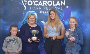  ??  ?? The winning team in the Harps Wonder Competitio­n at the O’Carolan Festival with Aileen Kennedy. From left, Niamh Byrne, Hilda Browne and Caoimhe Moran.