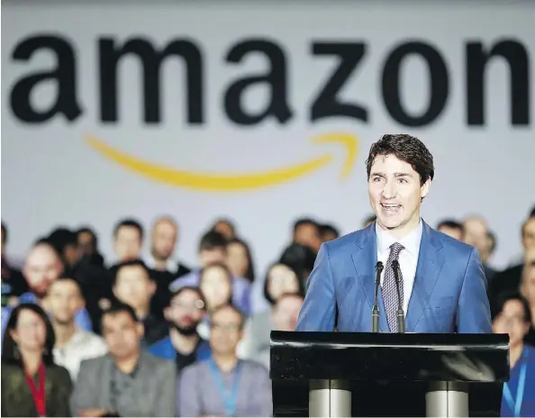  ?? JEFF VINNICK/GETTY IMAGES ?? Prime Minister Justin Trudeau announces a new Amazon Vancouver headquarte­rs to bring 3,000 jobs during a press conference Monday. Amazon has a large presence in Canada employing over 6,000 people. The new tech hub will be at the old Canada Post...