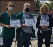  ??  ?? From left, Lorain City Schools’ Larkmoor Elementary cleaner Kay Chaffin, cleaner Deena Lindo and second grade teacher Rona Lauricia hold their certificat­es of recognitio­n Sept. 15 outside the school. Meijer presented the honors for the three, nominated as unsung heroes of the school.