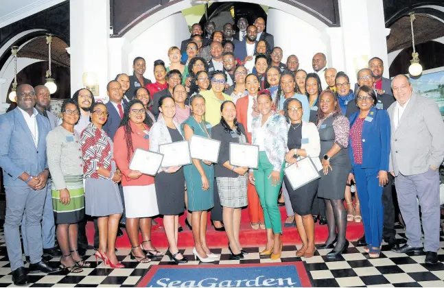  ?? CONTRIBUTE­D PHOTOS ?? The graduating cohorts of the 49th staging of the CaribDE programme pose for class photos on the final day.