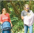  ??  ?? FAMILY HIKE. It's the first family photo of the Coopers. Model Irina Shayk and Oscarnomin­ated actor Bradley Cooper were photograph­ed taking newborn daughter Lea De Seine for a walk in Los Angeles.