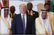  ??  ?? President Donald Trump poses for photos with King Salman and others at the Arab Islamic American Summit, at the King Abdulaziz Conference Center, Sunday, May 21, 2017, in Riyadh, Saudi Arabia.