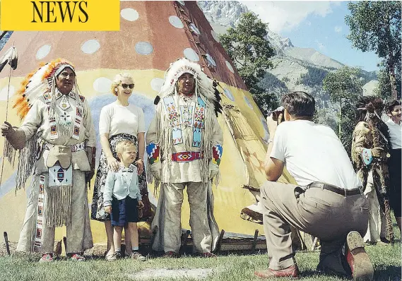  ?? ARCHIVES CANADA ?? A family takes part in the annual Banff Indian Days in 1957 in Banff National Park. Stoney band members were invited back to the land they once managed to entertain tourists until the event ended in the 1970s. Across Canada, Indigenous people were...