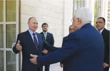  ?? (Aleksey Druzhini/Sputnik/Kremlin/Reuters) ?? RUSSIAN PRESIDENT Vladimir Putin welcomes PA President Mahmoud Abbas before their meeting in Sochi yesterday. Since his meeting with US President Donald Trump last week, Abbas has issued a number of statements hinting at flexibilit­y on previous demands...