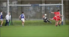  ??  ?? Éire Óg golakeeper Conor Browne makes one of several super saves.