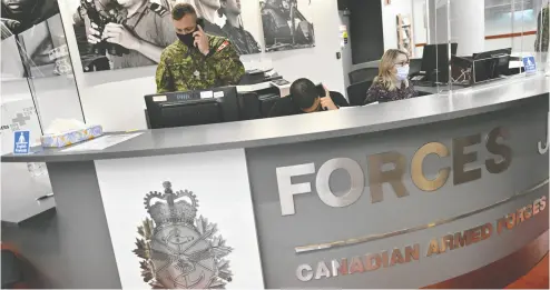  ?? JUSTIN TANG / THE CANADIAN PRESS ?? Staff work at a Canadian Armed Forces recruitmen­t centre in Ottawa last month. Defence chief Gen. Wayne Eyre
says there’s a “sense of urgency” as the military struggles to fill about 10,000 empty positions.