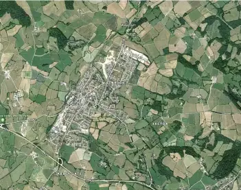  ?? PICTURE: GOOGLE ?? Aerial view of Axminster – the proposed relief road would run to the East of the town