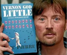  ?? PHOTO: REUTERS ?? DBC Pierre with his book Vernon God Little, which won the Man Booker Prize in 2003, and is being made into a film.