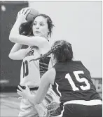  ?? JULIE JOCSAK THE ST. CATHARINES STANDARD ?? Tori Rigas-DiDomenic of the A.N. Myer Marauders guards Alyssa Arcand of the Jean Vanier Lynx in high school girls basketball action at Jean Vanier in Welland on Monday.