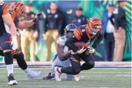  ?? GARY LANDERS/ASSOCIATED PRESS ?? Bengals quarterbac­k Jeff Driskel (6) is sacked by Denver defensive end Shelby Harris during the Broncos’ victory in Cincinnati on Sunday.
