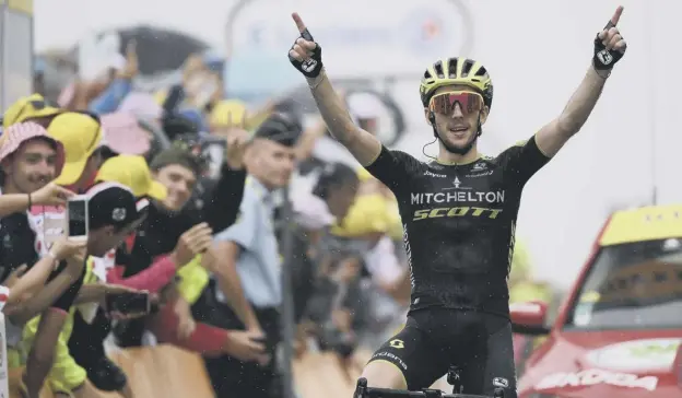  ?? PICTURE: JEFF PACHOUD AFP/GETTY IMAGES ?? 0 Britain’s Simon Yates celebrates as he crosses the finish line to win stage 15 of the Tour de France at Prat d’albis.