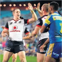  ?? Picture / Photosport ?? Ryan Hoffman congratula­tes Simon Mannering on his try last Friday against the Eels. David Skipwith