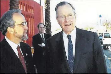  ?? Photo provided by Larry Ruvo ?? Larry Ruvo is shown with President George H.W. Bush at the Clark County Government Center during Bush’s visit in 2002.