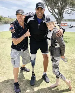  ?? AMY MAC IVER ?? Shark attack survivor Achmat Hassiem, centre, and double lung transplant recipient Tanya Bothma will be taking on a host of other survivors in the first Great Optimist Race this weekend. The race is the brainchild of big wave surfer Greg Bertish. |