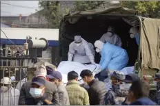  ?? AP photo ?? Medical personnel load the body of a victim onto a truck to be transporte­d to Kathmandu, in Pokhara, Nepal, on Tuesday. Nepalese authoritie­s on Tuesday began returning to families the bodies of victims of a flight that crashed Sunday, and said they were sending the aircraft's data recorder to France for analysis as they try to determine what caused the country’s deadliest plane accident in 30 years.