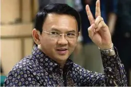  ?? [FOTO EPA] ?? Ahok didesak meletakkan jawatan sebagai Gabenor Jakarta atas tuduhan menghina Islam.