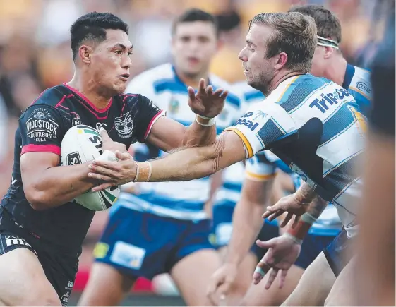  ?? Picture: GETTY IMAGES ?? The Titans will have to keep Roger Tuivasa-Sheck (left) in check when the two sides meet today at Cbus Super Stadium.