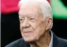  ?? The Associated Press ?? Former President Jimmy Carter sits on the Atlanta Falcons bench before the first half of an NFL game between the Atlanta Falcons and the San Diego Chargers, Oct. 23, 2016, in Atlanta.