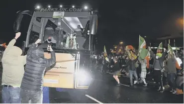  ??  ?? 0 Celtic fans greet the team bus after the cup final at Hampden