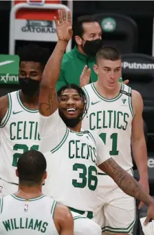  ?? NAncy LAnE PHOTOS / HErALd STAFF ?? BACK ON TRACK? Marcus Smart said the players meeting after Friday’s loss was about how they wanted the rest of the season to play out. Below, Brad Stevens said Kemba Walker will not play tonight in Memphis as the Celtics start a four-game road trip.