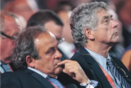  ??  ?? UEFA President Michel Platini, left, and FIFA vice president Angel Maria Villar Llona attend the preliminar­y draw for the 2018 World Cup St. Petersburg, Russia. Yesterday Villar resigned. Photo: AP