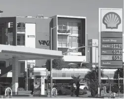  ?? Tribune News Service/los Angeles Times ?? Drivers select from various fuels priced near or more than $6 a gallon at a Shell gas station in Los Angeles on Nov. 15, 2021.