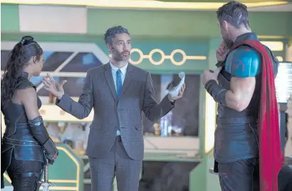  ??  ?? Taika Waititi on the set of with actors Tessa Thompson (Valkyrie) and Chris Hemsworth (Thor).