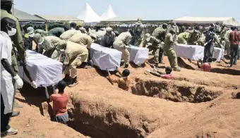  ?? KASUKU | AP | African News Agency (ANA) | ANDREW ?? Coffins of some of the 225 victims of the MV Nyerere passenger ferry capsizing are laid in graves during a mass burial ceremony on Ukara Island, Tanzania, on Sunday. The country’s defence minister said no further survivors were likely to be found and search efforts had ended.