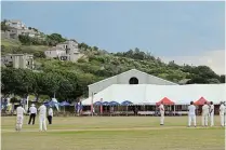  ?? ?? PICTURE PERFECT: The East v West Legends fixture on Monday at the Port Alfred Country Club took place with the scenic backdrop of the Pineapple tent and homes on the hill in the background.