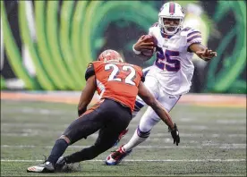  ?? JOHN GRIESHOP / GETTY IMAGES ?? William Jackson III of the Bengals attempts to tackle the Buffalo Bills’ LeSean McCoy during the fourth quarter at Paul Brown Stadium on Sunday.