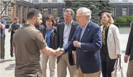  ?? UKRAINIAN PRESIDENTI­AL PRESS OFFICE VIA AP ?? Ukrainian President Volodymyr Zelenskyy, left, shakes hands with Senate Minority Leader Mitch McConnell during a surprise visit to Kyiv on Saturday. Zelenskyy, in an Instagram post, called the delegation of GOP senators’ visit “a strong signal of bipartisan support for Ukraine from the United States Congress and the American people.”