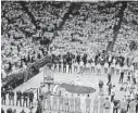  ?? WILFREDO LEE/AP ?? The Miami Heat, Boston Celtics and fans observe a moment of silence for the 19 children and two teachers killed Tuesday in the Robb Elementary School massacre in Uvalde, Texas, before Game 5 of the Eastern Conference finals playoff series Wednesday in Miami.