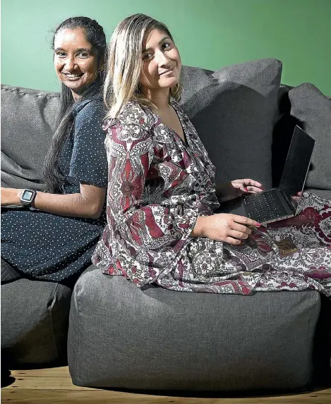  ??  ?? Millennial­s Suraksha Setty, 25, and Isabella Couwenberg, 23, work at software company Xero, where bean bags are among the perks.