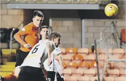  ??  ?? 2 Lawrence Shankland rises above the Partick defence to head Dundee United’s winner in the 62nd minute at Tannadice last night.