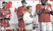  ?? ROGER STEINMAN/AP ?? Alabama head coach Nick Saban holds the Rose Bowl trophy after their win against Notre Dame in the College Football Playoff semifinals.
