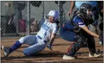  ?? TERRY PIERSON — STAFF PHOTOGRAPH­ER ?? Norco’s Tamryn Shorter scores as King catcher Kayla Penor waits for the throw in a Big VIII game.