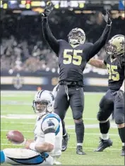  ?? Chris Graythen Getty Images ?? JONATHAN FREENY celebrates one of the Saints’ four sacks of Cam Newton, who later left the game.