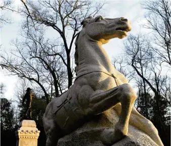  ?? STAFF PHOTO BY ROBIN RUDD ?? The rising sun catches the riderless horse on the monument to the 1st Wisconsin Cavalry last February in Chickamaug­a National Battlefiel­d Park.