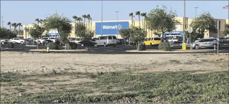  ?? PHOTO BY MARA KNAUB/YUMA SUN ?? THE WALMART ON AVENUE B WILL BUILD A NEW GAS STATION on the empty lot at the southwest corner of Avenue B and 28th Street. The Pacific Avenue store will have eight fuel dispensers and a convenienc­e store.