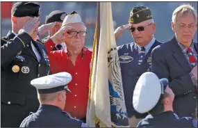  ??  ?? Pearl Harbor survivor William Chase (center left) participat­es in a commemorat­ion ceremony in 2015 at the Arkansas Inland Maritime Museum in North Little Rock. Many of this year’s commemorat­ions have been canceled because of the pandemic. (Democrat-Gazette file photo)