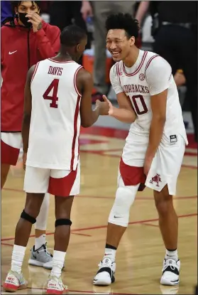  ?? Associated Press ?? Celebrate: Arkansas players Davonte Davis (4) and Jaylin Williams (10) celebrate after defeating LSU in Fayettevil­le Saturday,