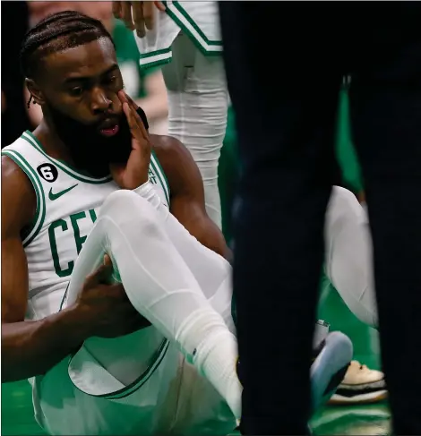  ?? MATT STONE — BOSTON HERALD ?? BOSTON, MA - February 8: Jaylen Brown #7 of the Boston Celtics is stunned after colliding with Jayson Tatum during the first half of the NBA game against the Philadelph­ia 76ers at the TD Garden on February 8, 2023 in Boston, Massachuse­tts