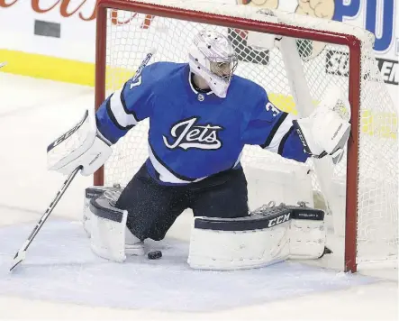  ?? TREVOR HAGAN/THE CANADIAN PRESS ?? Winnipeg Jets goaltender Connor Hellebuyck let in a few softies Tuesday in a 4-3 loss to Pittsburgh. His save percentage is down this year and goals against average is up.