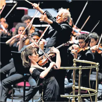  ??  ?? Freewheeli­ng exuberance: Lisa Batiashvil­i performing Tchaikovsk­y’s Violin Concerto under the baton of Daniel Barenboim