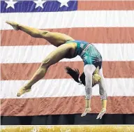  ?? CHARLIE RIEDEL/ASSOCIATED PRESS ?? Simone Biles competes on the beam at the U.S. Gymnastics Championsh­ips on Friday in Kansas City, Mo.