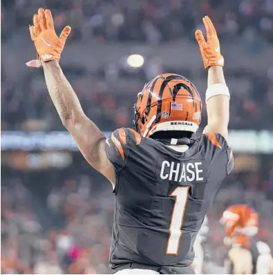  ?? JEFF DEAN/AP ?? Bengals wide receiver Ja’Marr Chase celebrates a touchdown by teammate Tyler Boyd in the AFC wild-card game on Saturday.