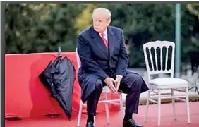  ??  ?? President Trump looks on during the American Commemorat­ion Ceremony at the Suresnes American Cemetery in Paris on Sunday. (Marlene Awaad/ Bloomberg)