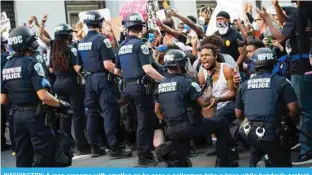  ?? – AFP ?? WASHINGTON: A man screams with emotion as he sees a policeman take a knee while hundreds protest the death of George Floyd next to the White House on May 31, 2020.